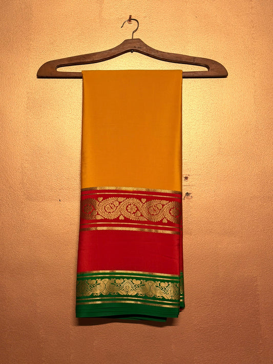 Kanakadhara — Golden Yellow Silk Saree with Red Bentex Border & Green Pallu