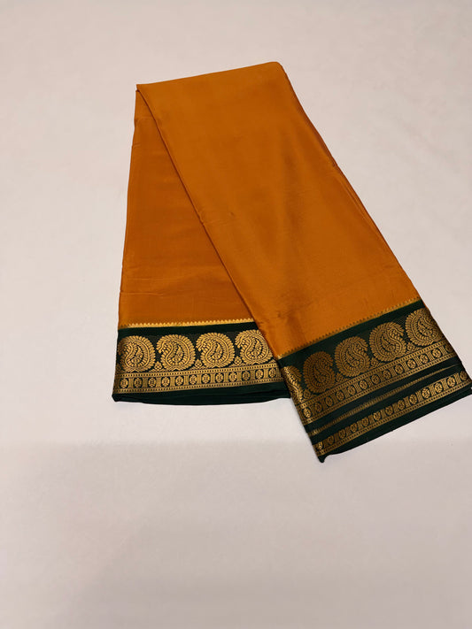 Kanakambari — Deep Mustard Orange Silk Saree with Bottle Green Zari Border