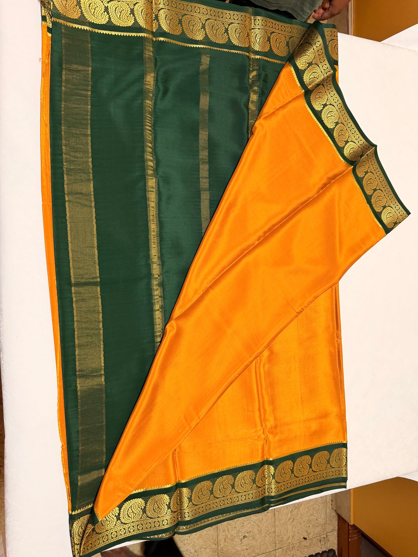 Kanakambari — Deep Mustard Orange Silk Saree with Bottle Green Zari Border