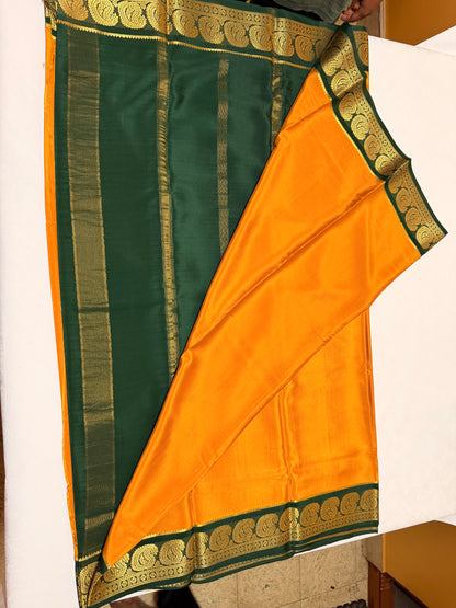 Kanakambari — Deep Mustard Orange Silk Saree with Bottle Green Zari Border