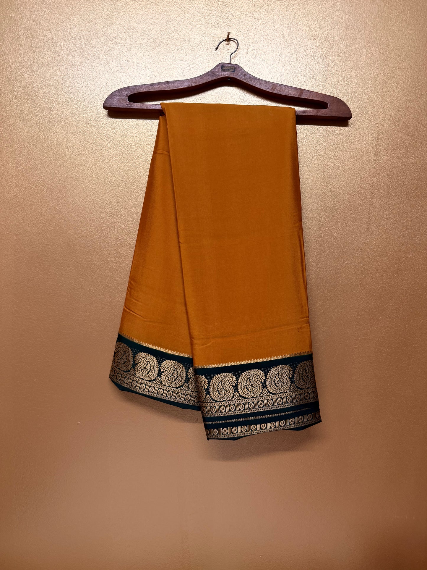 Kanakambari — Deep Mustard Orange Silk Saree with Bottle Green Zari Border