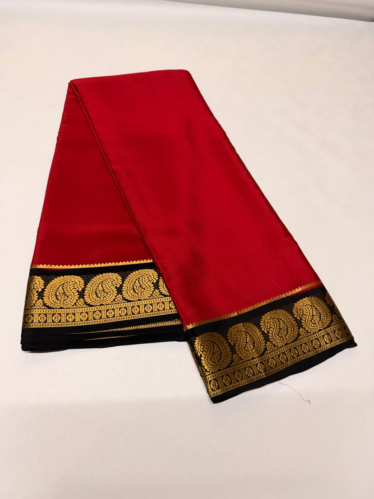 Raktakshi — Vermilion Red Silk Saree with Black Zari Border