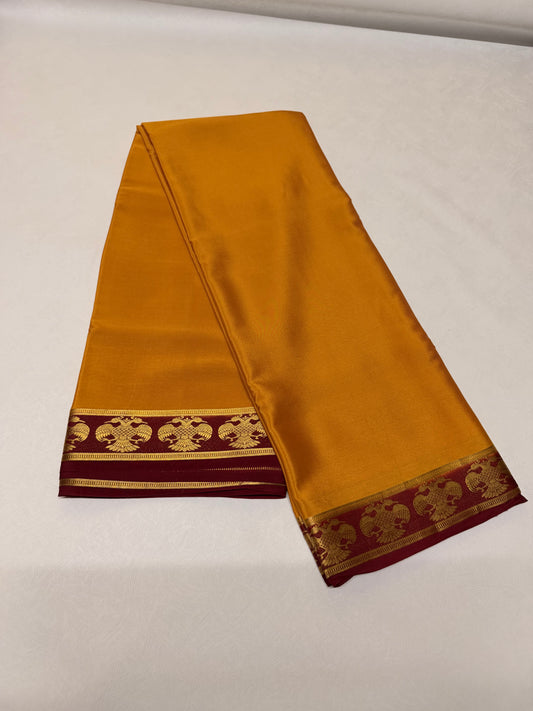 Kanakambari — Mustard Gold Silk Saree with Maroon Gandaberunda Zari Border