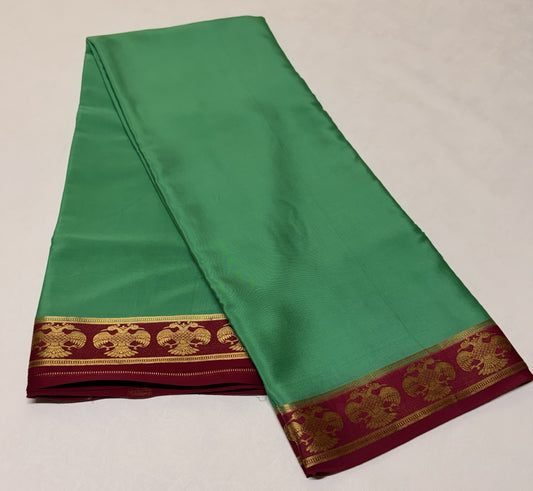 Haritha — Emerald Green Silk Saree with Maroon Gandaberunda Zari Border
