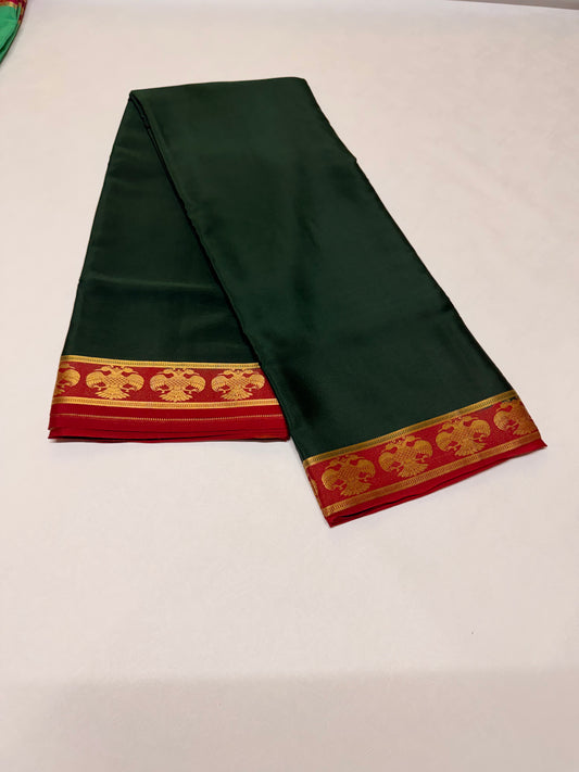 Neelavalli — Deep Bottle Green Silk Saree with Red & Gold Gandaberunda Border