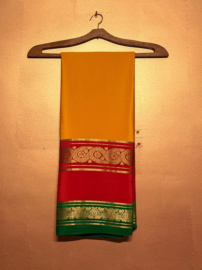 Kanakadhara — Golden Yellow Silk Saree with Red Bentex Border & Green Pallu