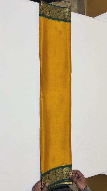 Kanakambari — Deep Mustard Orange Silk Saree with Bottle Green Zari Border